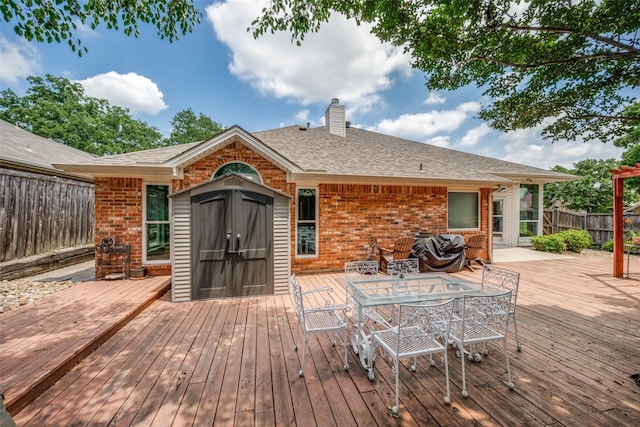 2925 Custer Dr, Corinth, TX 76210 - deck with outdoor dining space and a storage unit