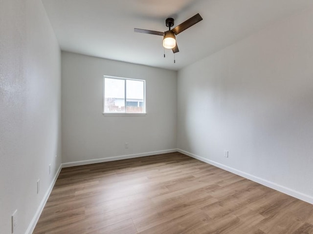 2032 Meadfoot Rd, Carrollton, TX 75007 - spare room featuring light wood-type flooring, a ceiling fan, and baseboards