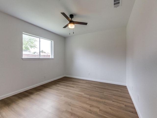 2032 Meadfoot Rd, Carrollton, TX 75007 - spare room with ceiling fan, wood finished floors, and baseboards