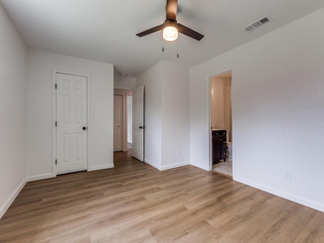 2032 Meadfoot Rd, Carrollton, TX 75007 - unfurnished bedroom with baseboards, light wood finished floors, and ensuite bath