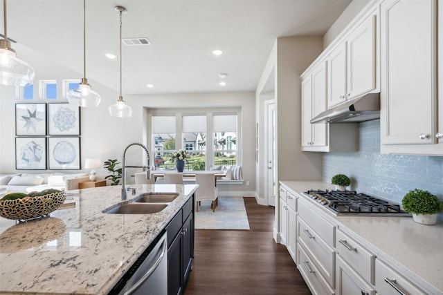 14436 Greymoore Cir, Fort Worth, TX 76008 - kitchen with a sink, stainless steel appliances, under cabinet range hood, backsplash, and white cabinets