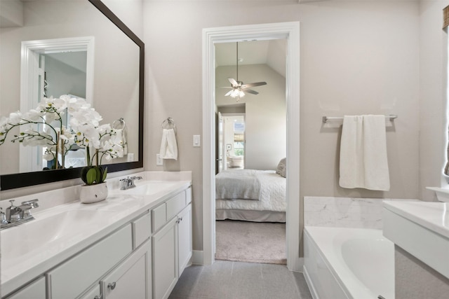 14436 Greymoore Cir, Fort Worth, TX 76008 - full bathroom featuring ensuite bathroom, a tub to relax in, vaulted ceiling, double vanity, and ceiling fan