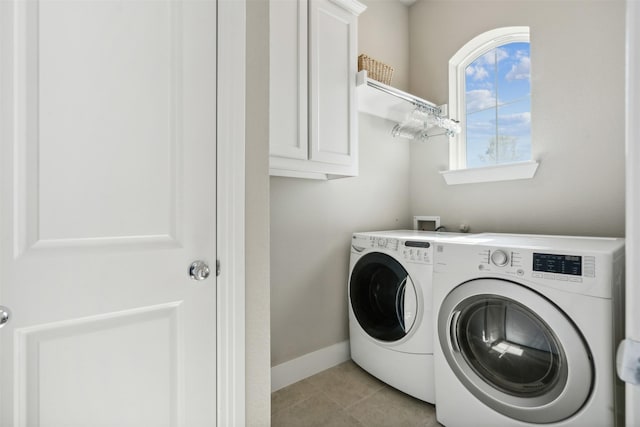 14436 Greymoore Cir, Fort Worth, TX 76008 - laundry room featuring washing machine and clothes dryer, cabinet space, light tile patterned flooring, and baseboards