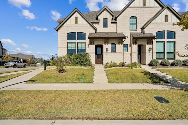14436 Greymoore Cir, Fort Worth, TX 76008 - view of front facade featuring brick siding, a front lawn, and roof with shingles