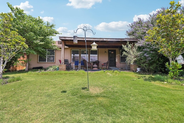 14709 Crystal Lake Dr, Little Elm, TX 75068 - rear view of house featuring a lawn and a porch
