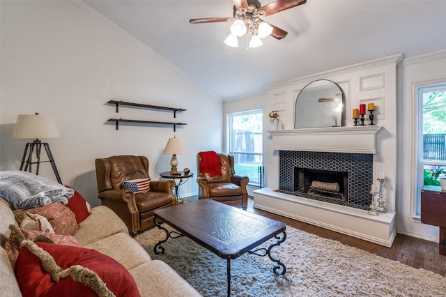 8070 Rock Brook St, Frisco, TX 75034 - living area with vaulted ceiling, ornamental molding, a ceiling fan, a tile fireplace, and wood finished floors