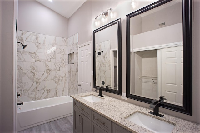 4136 Periwinkle Dr, Fort Worth, TX 76137 - full bath featuring double vanity, washtub / shower combination, and wood finished floors