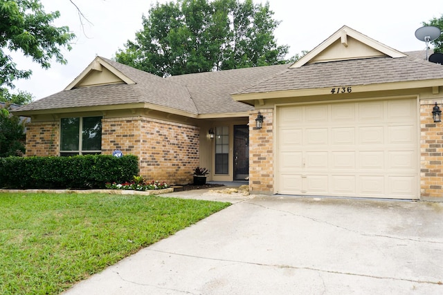 4136 Periwinkle Dr, Fort Worth, TX 76137 - single story home featuring brick siding, roof with shingles, and driveway