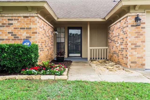 4136 Periwinkle Dr, Fort Worth, TX 76137 - doorway to property featuring brick siding and a shingled roof