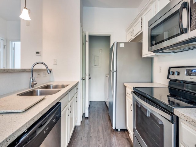 4113 Esters Rd Unit 605, Irving, TX 75038 - kitchen with appliances with stainless steel finishes, a sink, white cabinets, dark wood-style flooring, and light stone countertops