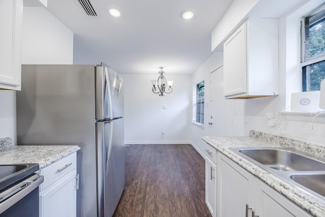 1206 Curtis Dr, Garland, TX 75040 - kitchen with white cabinets, dark wood-style floors, a chandelier, recessed lighting, and baseboards