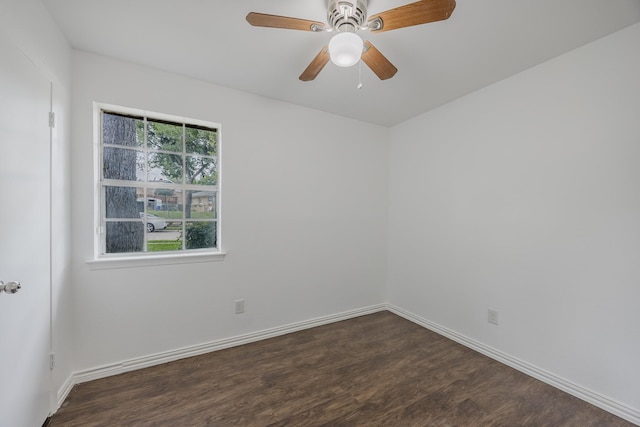 1206 Curtis Dr, Garland, TX 75040 - unfurnished room featuring dark wood finished floors, baseboards, and ceiling fan