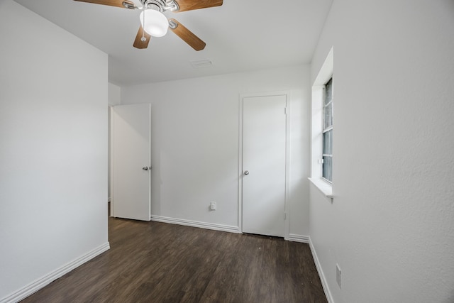 1206 Curtis Dr, Garland, TX 75040 - unfurnished bedroom with wood finished floors, baseboards, and ceiling fan