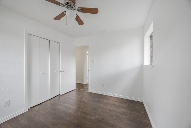 1206 Curtis Dr, Garland, TX 75040 - unfurnished bedroom featuring wood finished floors, baseboards, a closet, and a ceiling fan