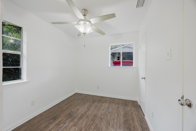 1206 Curtis Dr, Garland, TX 75040 - empty room with dark wood-type flooring, baseboards, and a ceiling fan