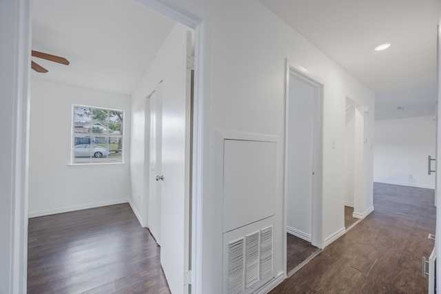 1206 Curtis Dr, Garland, TX 75040 - hallway with dark wood-style flooring and baseboards