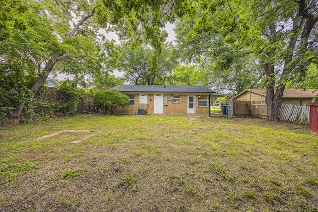 1206 Curtis Dr, Garland, TX 75040 - back of house with brick siding and cooling unit