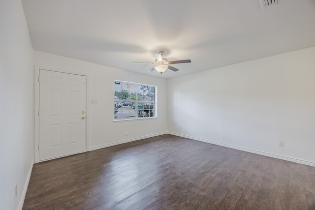 1206 Curtis Dr, Garland, TX 75040 - empty room featuring ceiling fan, dark wood-type flooring, and baseboards