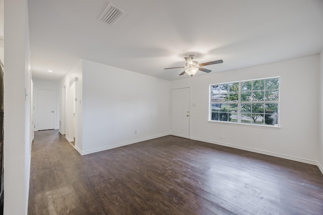 1206 Curtis Dr, Garland, TX 75040 - unfurnished room with ceiling fan, dark wood finished floors, and baseboards
