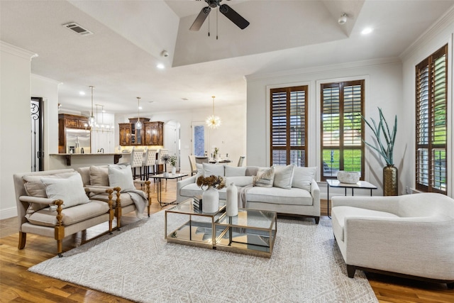 1516 Hawthorne Ln, Keller, TX 76262 - living room featuring ceiling fan, recessed lighting, wood finished floors, crown molding, and a chandelier