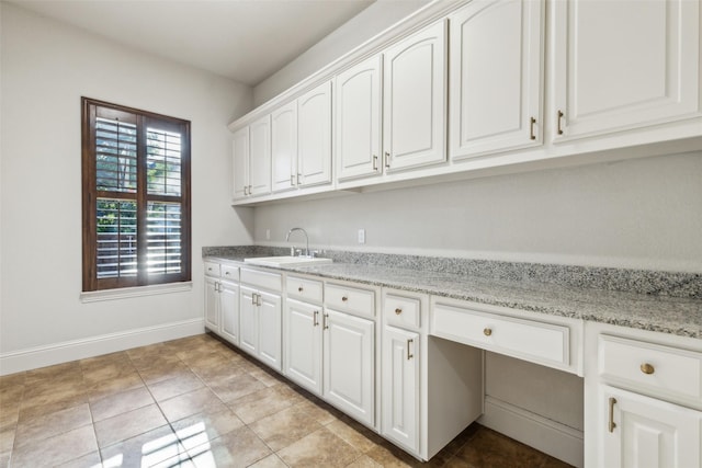 1516 Hawthorne Ln, Keller, TX 76262 - laundry room featuring a sink, baseboards, and light tile patterned floors