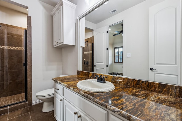 1516 Hawthorne Ln, Keller, TX 76262 - bathroom featuring toilet, a shower stall, vanity, tile patterned floors, and ceiling fan