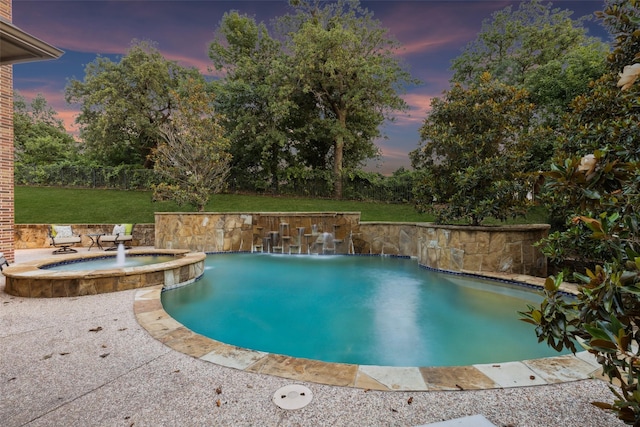 1516 Hawthorne Ln, Keller, TX 76262 - pool at dusk with a pool with connected hot tub, a lawn, and a patio