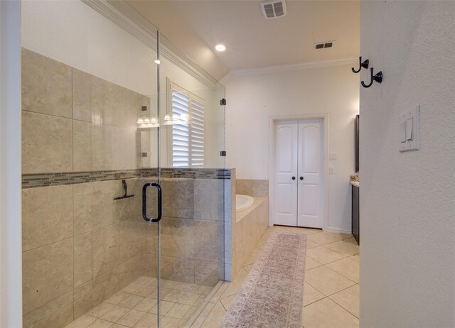 312 Spring Run Dr, Decatur, TX 76234 - bathroom with crown molding, a garden tub, a shower stall, tile patterned floors, and vanity