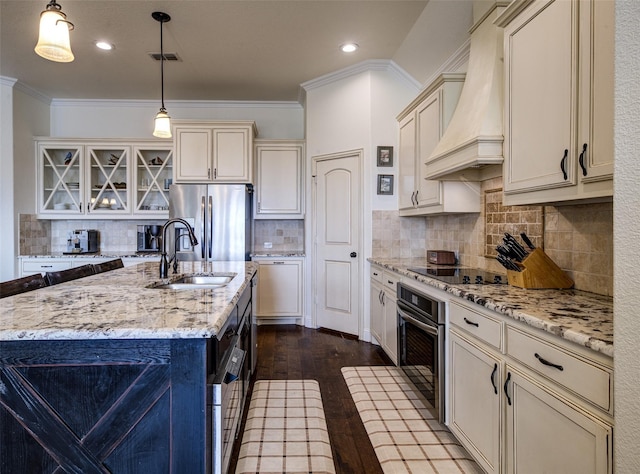 312 Spring Run Dr, Decatur, TX 76234 - kitchen with a sink, appliances with stainless steel finishes, custom exhaust hood, dark wood finished floors, and cream cabinets