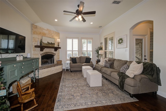 312 Spring Run Dr, Decatur, TX 76234 - living area with ceiling fan, dark wood-type flooring, arched walkways, a fireplace, and ornamental molding