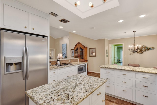 2414 Meadows Ln, Sherman, TX 75092 - kitchen with appliances with stainless steel finishes, white cabinets, a center island, a chandelier, and recessed lighting