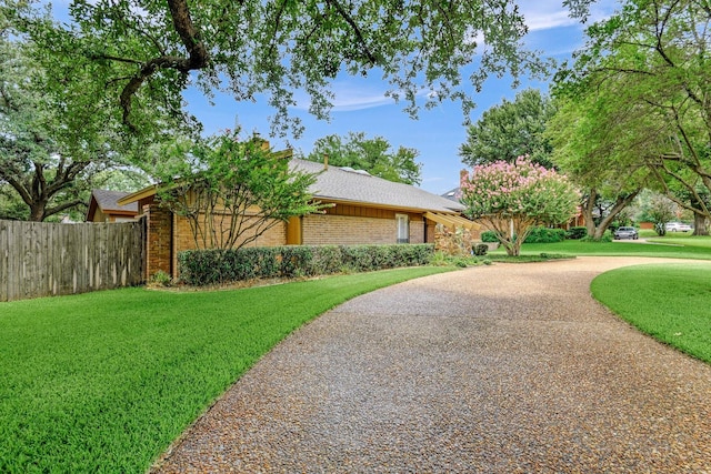 2414 Meadows Ln, Sherman, TX 75092 - view of side of home with brick siding