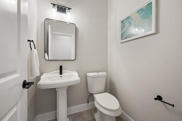 850 White River Dr, Prosper, TX 75078 - bathroom featuring toilet and baseboards