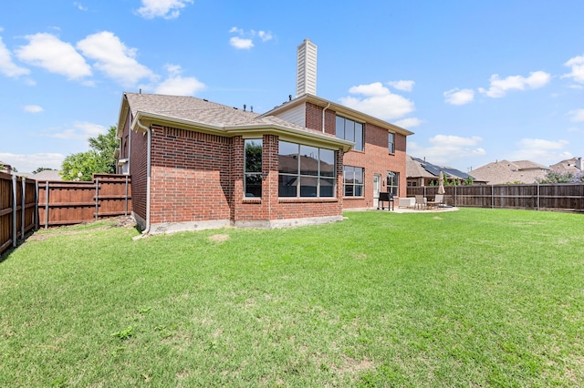 850 White River Dr, Prosper, TX 75078 - back of property featuring brick siding, a patio, and a chimney