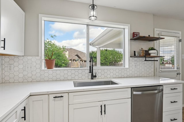 6128 Redear Dr, Fort Worth, TX 76179 - kitchen featuring dishwasher, a sink, white cabinetry, light countertops, and backsplash