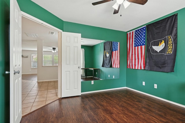 6128 Redear Dr, Fort Worth, TX 76179 - empty room featuring ceiling fan, wood finished floors, and baseboards
