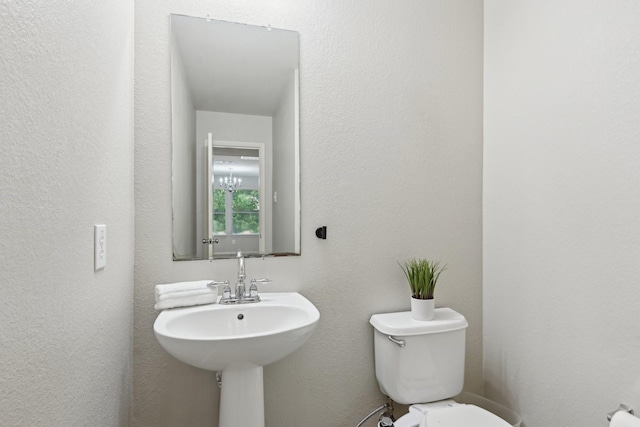 6128 Redear Dr, Fort Worth, TX 76179 - half bathroom with toilet and a textured wall