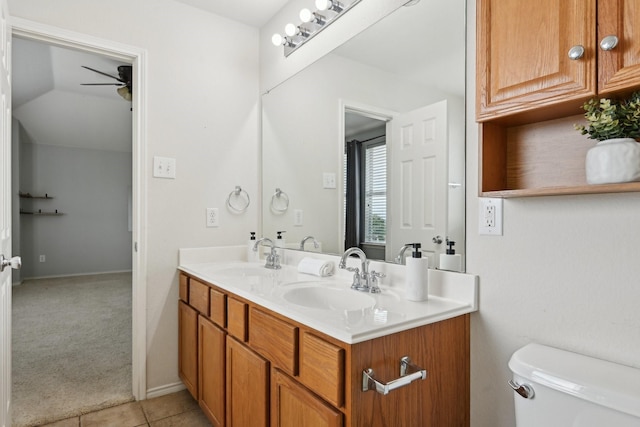 6128 Redear Dr, Fort Worth, TX 76179 - bathroom featuring ceiling fan, double vanity, toilet, and tile patterned floors