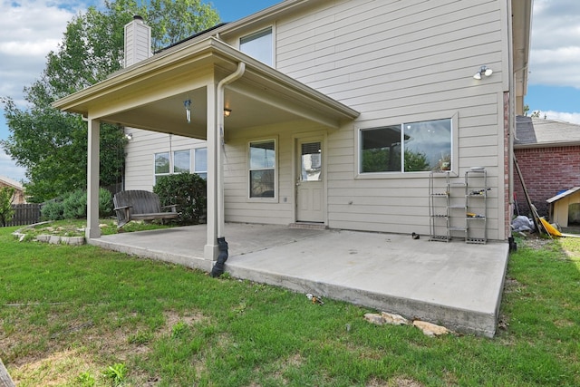 6128 Redear Dr, Fort Worth, TX 76179 - back of house featuring a patio area, a chimney, and a yard