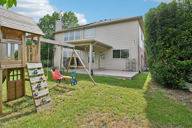 6128 Redear Dr, Fort Worth, TX 76179 - back of property with a patio area, a chimney, a lawn, and a playground