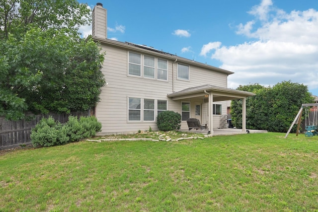 6128 Redear Dr, Fort Worth, TX 76179 - back of house with a patio, a playground, and a chimney