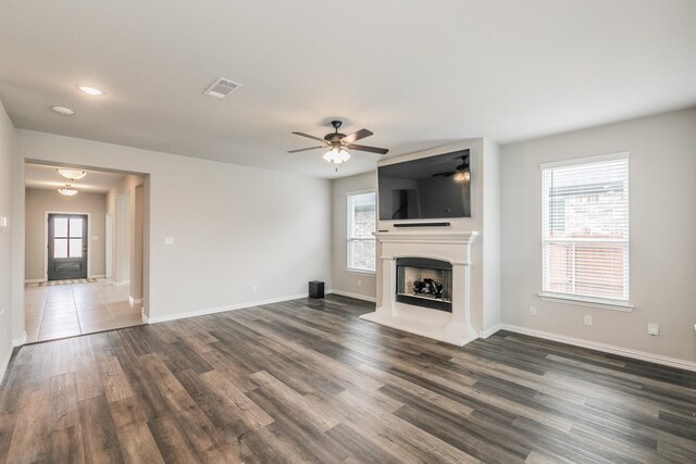 2028 Proteus Dr, Haslet, TX 76052 - unfurnished living room with dark wood-style floors, a ceiling fan, baseboards, and recessed lighting