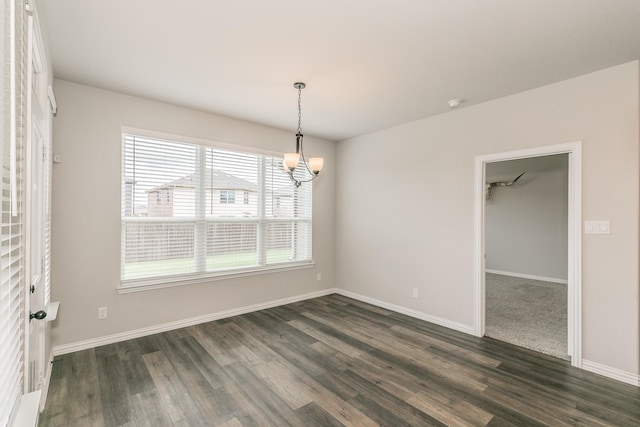 2028 Proteus Dr, Haslet, TX 76052 - unfurnished room featuring dark wood finished floors, a chandelier, and baseboards