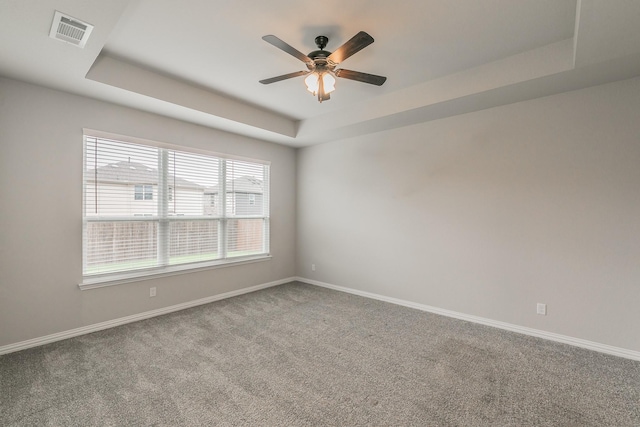 2028 Proteus Dr, Haslet, TX 76052 - carpeted spare room with a tray ceiling, baseboards, and a ceiling fan