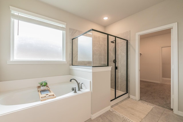 2028 Proteus Dr, Haslet, TX 76052 - bathroom with a bath, a stall shower, tile patterned flooring, and recessed lighting