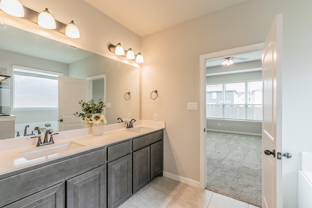 2028 Proteus Dr, Haslet, TX 76052 - bathroom with double vanity, tile patterned flooring, ceiling fan, and baseboards