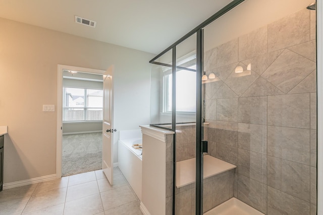 2028 Proteus Dr, Haslet, TX 76052 - full bath with a stall shower, a garden tub, tile patterned flooring, vanity, and baseboards