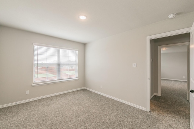 2028 Proteus Dr, Haslet, TX 76052 - carpeted empty room featuring a smoke detector, baseboards, and recessed lighting