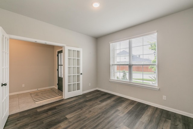 2028 Proteus Dr, Haslet, TX 76052 - empty room featuring french doors, plenty of natural light, baseboards, and recessed lighting