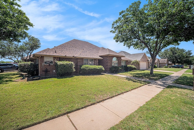 5501 Gateway Ln, Arlington, TX 76017 - french country style house with brick siding, a front yard, an attached garage, roof with shingles, and driveway